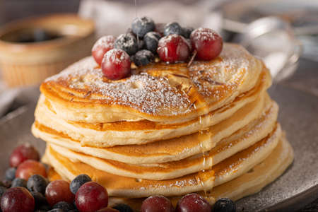 American pancakes with berries and maple syrupの写真素材