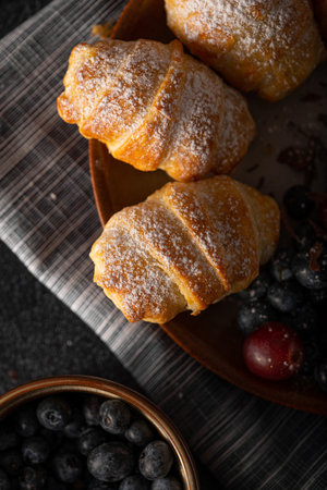 Chocolate filled pastry with berries, all homemadeの写真素材