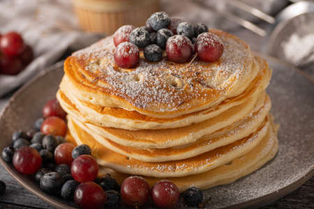 American pancakes with berries and maple syrupの写真素材
