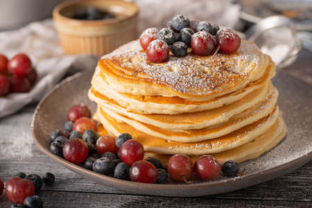 American pancakes with berries and maple syrupの写真素材