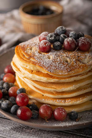 American pancakes with berries and maple syrupの写真素材