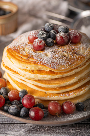 American pancakes with berries and maple syrupの写真素材