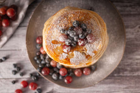 American pancakes with berries and maple syrupの写真素材