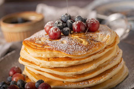 American pancakes with berries and maple syrupの写真素材