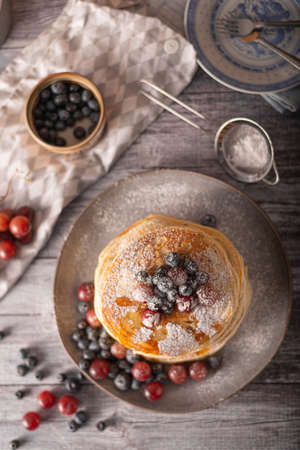 American pancakes with berries and maple syrupの写真素材