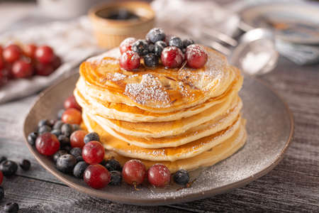 American pancakes with berries and maple syrupの写真素材