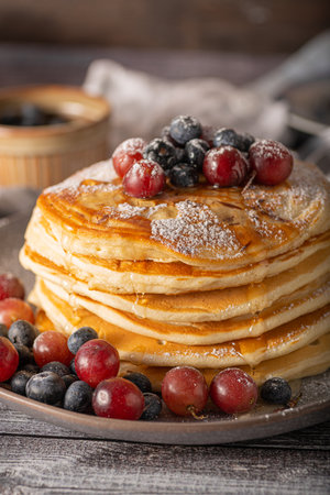 American pancakes with berries and maple syrupの写真素材