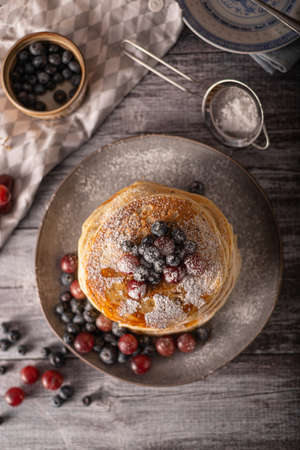 American pancakes with berries and maple syrupの写真素材