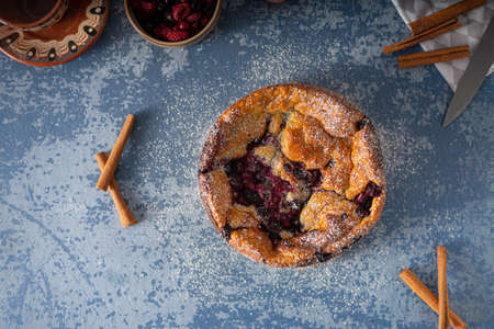 Delicious pie with fresh berries and lemon
