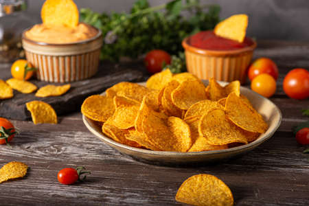 Delicious tortilla chips witch chili and cheese sauceの写真素材