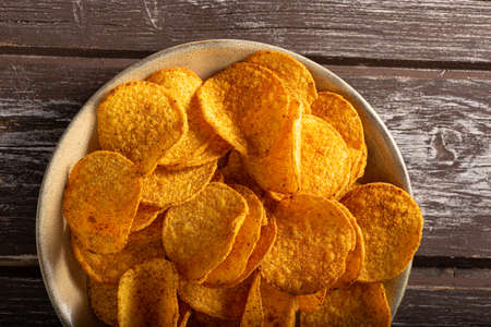 Delicious tortilla chips witch chili and cheese sauceの写真素材