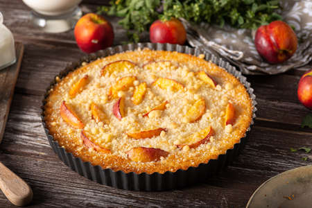 Nectarine tart with sugar and fresh mintの写真素材