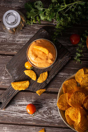 Organic paprika chips with tomatoes and herbsの写真素材