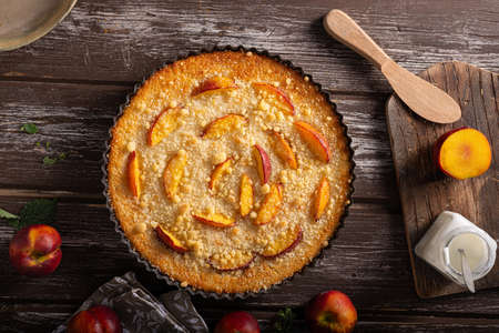 Nectarine tart with sugar and fresh mintの写真素材