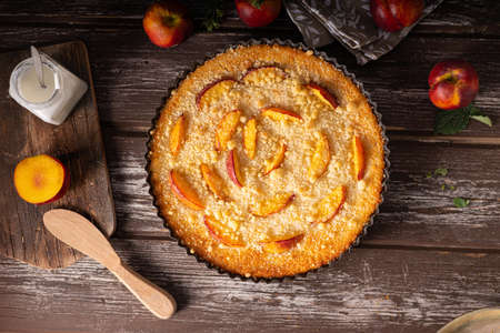 Nectarine tart with sugar and fresh mintの写真素材