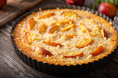 Nectarine tart with sugar and fresh mintの写真素材