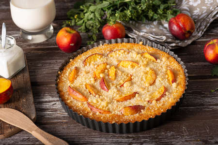 Nectarine tart with sugar and fresh mintの写真素材