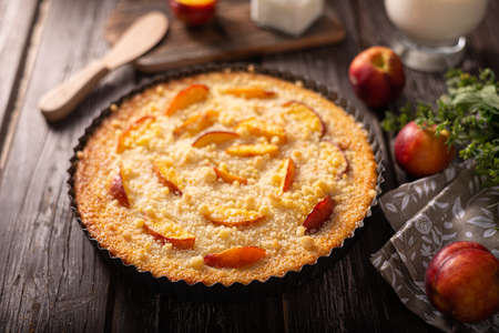 Nectarine tart with sugar and fresh mintの写真素材