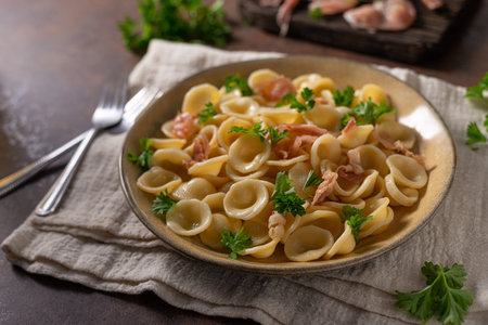 Delicious pasta with garlic, ham and parmesanの写真素材