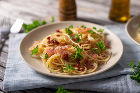 Delicious pasta with garlic, ham and parmesanの写真素材