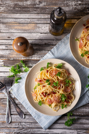 Delicious pasta with garlic, ham and parmesanの写真素材