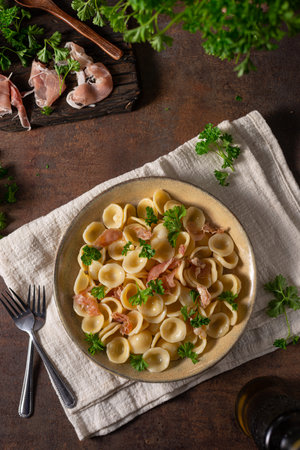 Delicious pasta with garlic, ham and parmesanの写真素材