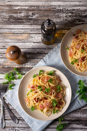 Delicious pasta with garlic, ham and parmesanの写真素材