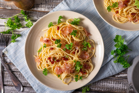 Delicious pasta with garlic, ham and parmesanの写真素材