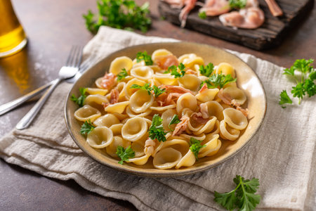 Delicious pasta with garlic, ham and parmesanの写真素材
