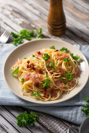Delicious pasta with garlic, ham and parmesanの写真素材