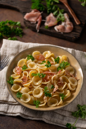 Delicious pasta with garlic, ham and parmesanの写真素材