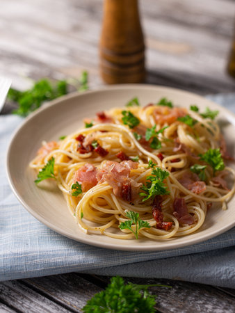 Delicious pasta with garlic, ham and parmesanの写真素材