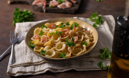 Delicious pasta with garlic, ham and parmesanの写真素材