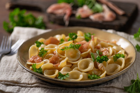 Delicious pasta with garlic, ham and parmesanの写真素材