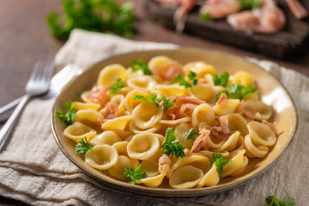 Delicious pasta with garlic, ham and parmesanの写真素材
