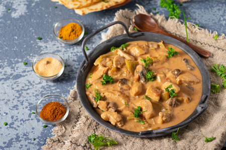 Tikka masala with herbs and homemade naan breadの写真素材