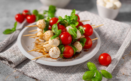 Simple and beautiful food with basil, mozzarella and balsamic vinegarの写真素材