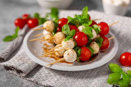 Simple and beautiful food with basil, mozzarella and balsamic vinegarの写真素材