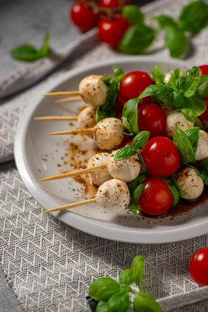 Simple and beautiful food with basil, mozzarella and balsamic vinegarの写真素材