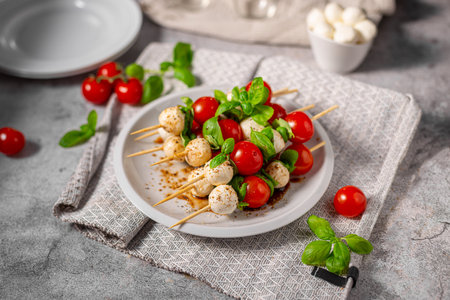Simple and beautiful food with basil, mozzarella and balsamic vinegarの写真素材