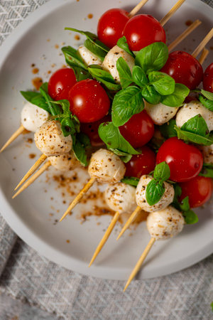 Simple and beautiful food with basil, mozzarella and balsamic vinegarの写真素材