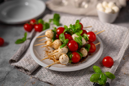 Simple and beautiful food with basil, mozzarella and balsamic vinegarの写真素材