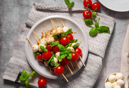 Simple and beautiful food with basil, mozzarella and balsamic vinegarの写真素材