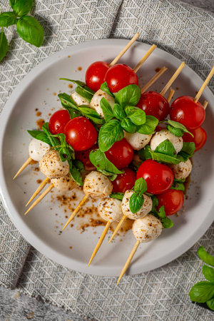 Simple and beautiful food with basil, mozzarella and balsamic vinegarの写真素材