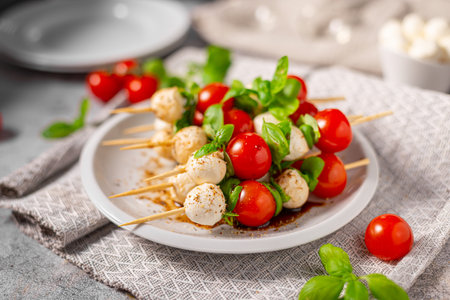 Simple and beautiful food with basil, mozzarella and balsamic vinegarの写真素材