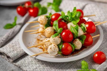Simple and beautiful food with basil, mozzarella and balsamic vinegarの写真素材