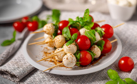 Simple and beautiful food with basil, mozzarella and balsamic vinegarの写真素材