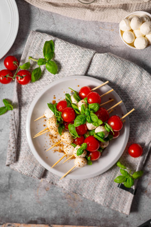 Simple and beautiful food with basil, mozzarella and balsamic vinegarの写真素材