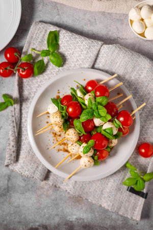 Simple and beautiful food with basil, mozzarella and balsamic vinegarの写真素材