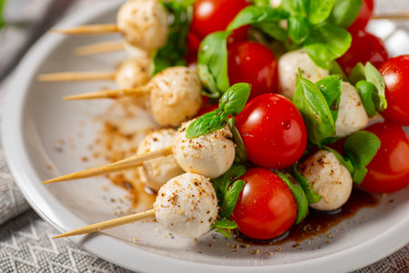 Simple and beautiful food with basil, mozzarella and balsamic vinegarの写真素材
